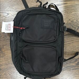 Topo Designs Black Backpack with Multiple Compartments and Adjustable Straps